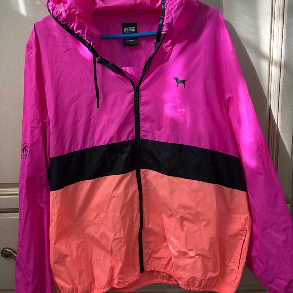 Pink windbreaker with logo on sleeve and back. - Picture 1 of 6